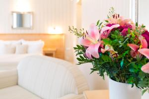 Giường trong phòng chung tại Unitas Hotel