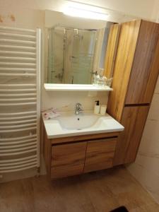 a bathroom with a sink and a mirror at Nonićeva Hiža in Fužine +67 photos