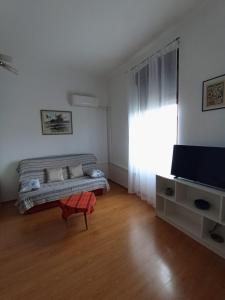 TV a/nebo společenská místnost v ubytování Studio Bella
