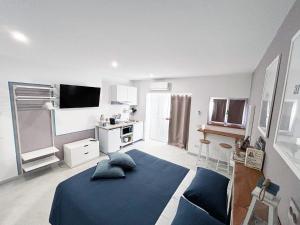 a bedroom with a blue bed in a room at La Bouganville in Assisi