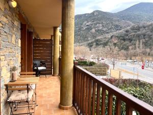 a balcony of a house with a view of a mountain at El Secret del Pirineu - L'Amfitriona in Baro +22 photos
