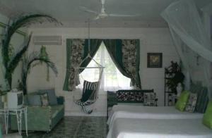 a bedroom with two beds and a window at The Legend Garden Condos in Saint Peter