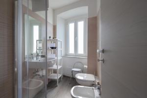 a bathroom with a toilet and a sink at Melody - little Riomaggiore room - in Riomaggiore