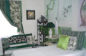 a room with a bed and a couch and a chair at The Legend Garden Condos in Saint Peter