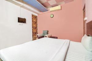 Postel nebo postele na pokoji v ubytování Hotel O The Shagun Residency