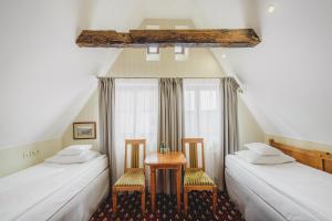 Rúm í herbergi á Hotel Solaris