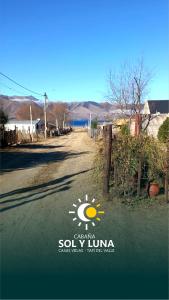 a sign on the side of a road with a sun at Cabaña Sol&Luna in Tafí del Valle