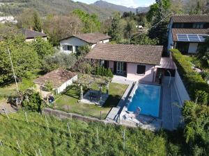 an aerial view of a house with a swimming pool at Casa Alla Vigna - Lugano in Pregassona