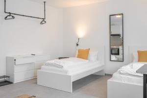 Postel nebo postele na pokoji v ubytování EasyOne Apartments