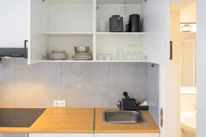 Kuchyň nebo kuchyňský kout v ubytování EasyOne Apartments