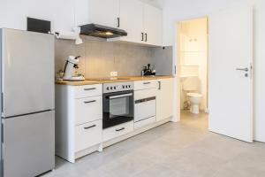 Kuchyň nebo kuchyňský kout v ubytování EasyOne Apartments