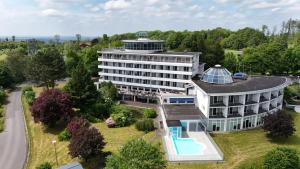 an aerial view of a building with a swimming pool at Wildpark Hotel in Bad Marienberg