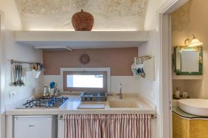 Η κουζίνα ή μικρή κουζίνα στο Casa vacanze a Sud di Leuca +39 φωτογραφίες