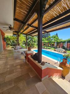 a patio with a table and a swimming pool at A Casa del Farmacista in Casarano
