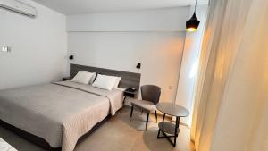 Postel nebo postele na pokoji v ubytování Navarria Blue Hotel