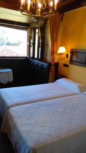 Кровать или кровати в номере Casa de Aldea El Torrexon