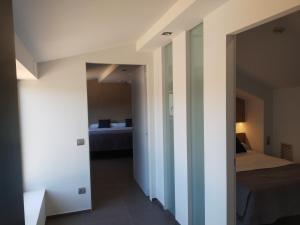 A bed or beds in a room at Hotel Olot Centre