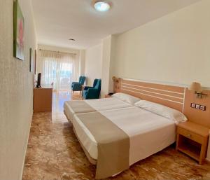 Posteľ alebo postele v izbe v ubytovaní Hotel La Familia