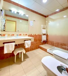 Kúpeľňa v ubytovaní Hotel La Familia