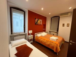 A bed or beds in a room at Residenza della Samaritana Classici