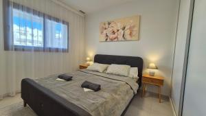 a bedroom with a bed with two pillows on it at Casa Arona in San Juan de los Terreros +43 photos