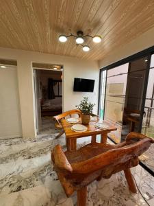 a dining room with a wooden table and chairs at Mountain Sunctuary-TD Solo Unit for friends and family in Baguio
