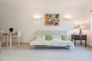 a living room with a couch and a table at CCC - Cascais Calm & Comfort in Cascais