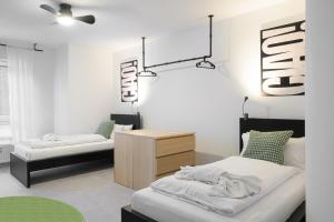 Postel nebo postele na pokoji v ubytování EasyOne Apartments