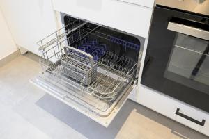 Kuchyň nebo kuchyňský kout v ubytování EasyOne Apartments