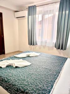Ένα ή περισσότερα κρεβάτια σε δωμάτιο στο VN Home 1