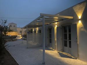 a building with awning on the side of it at Brizo - TCupStudios in Kythira