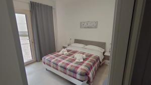 Llit o llits en una habitació de B&B-Guest house 'IN PIAZZETTA'