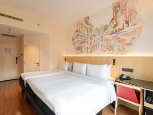 Ibis Singapore on Bencoolen - Newly Renovated客房内的一张或多张床位
