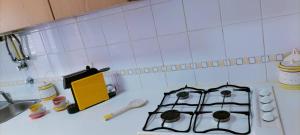 a kitchen counter with a stove and a sink at Holiday Spot in Portimão +22 photos