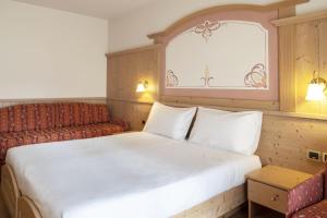 Voodi või voodid majutusasutuse Beverly Alps Hotel & Spa toas