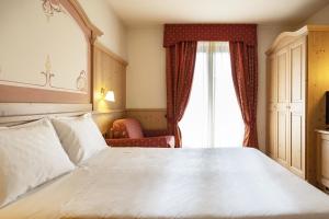 Voodi või voodid majutusasutuse Beverly Alps Hotel & Spa toas