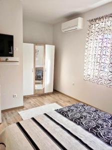 Ένα ή περισσότερα κρεβάτια σε δωμάτιο στο VN Home 2