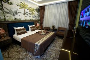 Postel nebo postele na pokoji v ubytování Atlas Hotel Baku