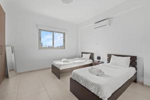 Postel nebo postele na pokoji v ubytování Downtown Comfort Apartment