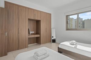 Postel nebo postele na pokoji v ubytování Downtown Comfort Apartment + 6 fotografií