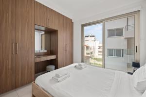 Postel nebo postele na pokoji v ubytování Downtown Comfort Apartment