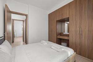 Postel nebo postele na pokoji v ubytování Downtown Comfort Apartment