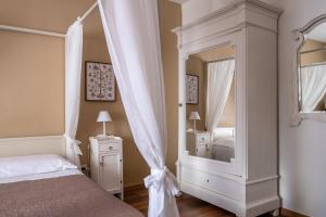 Letto o letti in una camera di Dimora Lorè