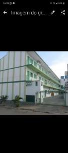 a picture of a building with the words imperialism do git at Residencial Valérios in Cuiabá