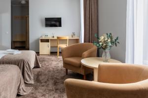 TV a/nebo společenská místnost v ubytování Domus Hotel