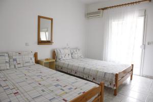 Postel nebo postele na pokoji v ubytování Flora Rooms