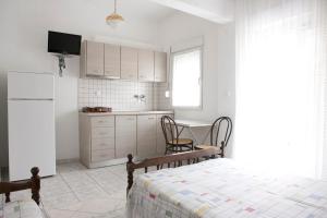 Kuchyň nebo kuchyňský kout v ubytování Flora Rooms