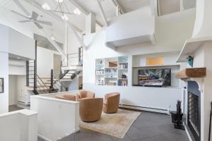 a living room with two chairs and a staircase at 895 County Road 206 in Durango