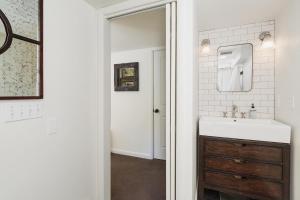a bathroom with a sink and a mirror at 895 County Road 206 in Durango +54 photos