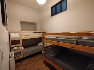 En eller flere senge i et værelse på Appartement 4 chambres avec terrasse